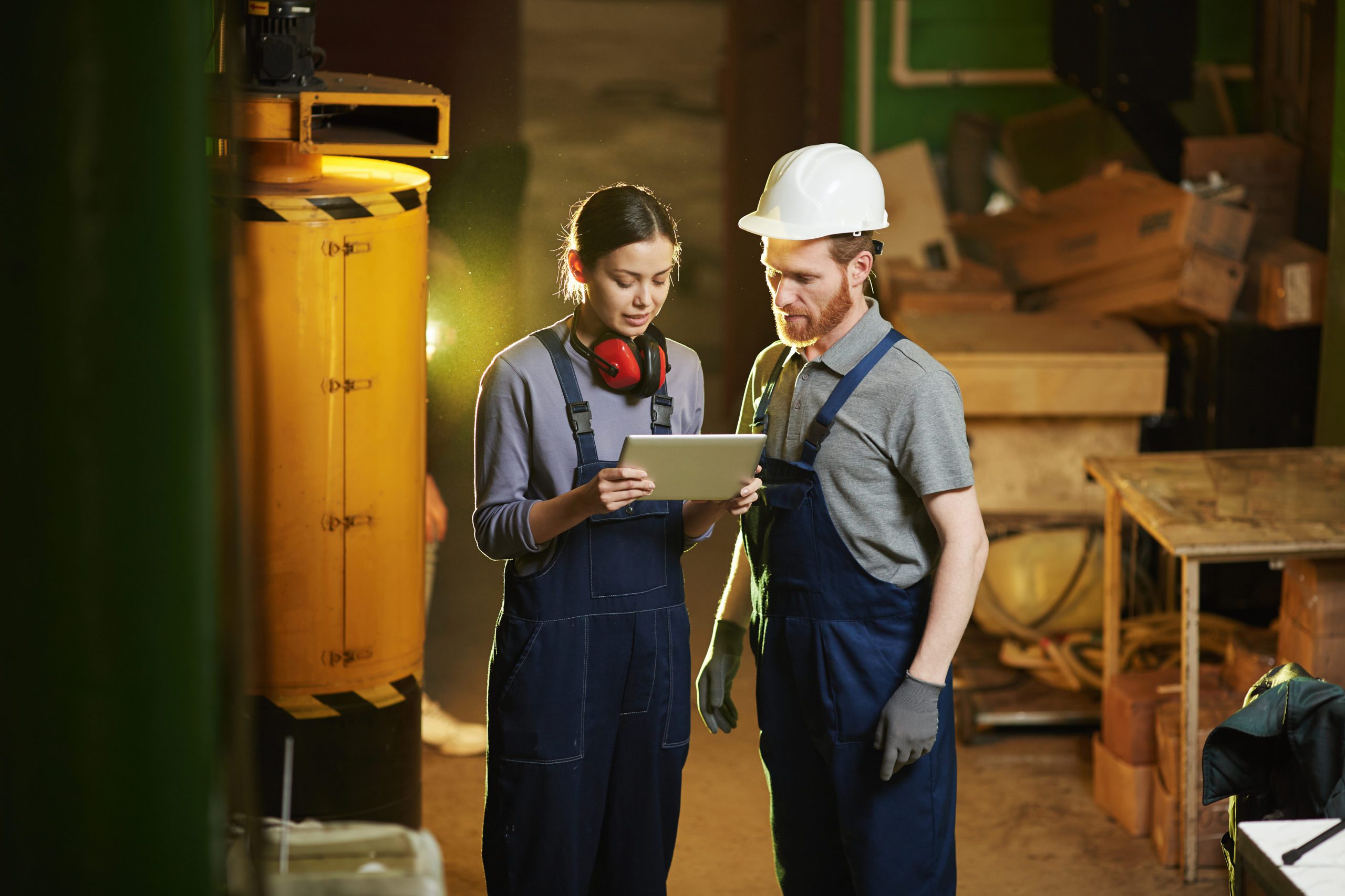 People using tablet pc in the plant
